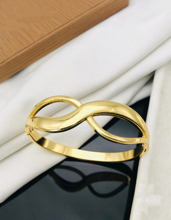 Infinity Twist Bangle – Symbol of Eternal Elegance