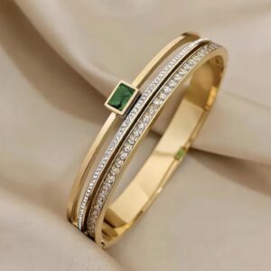 Elegant Dual-Line Bangle with Emerald Centerpiece and Diamond Accents